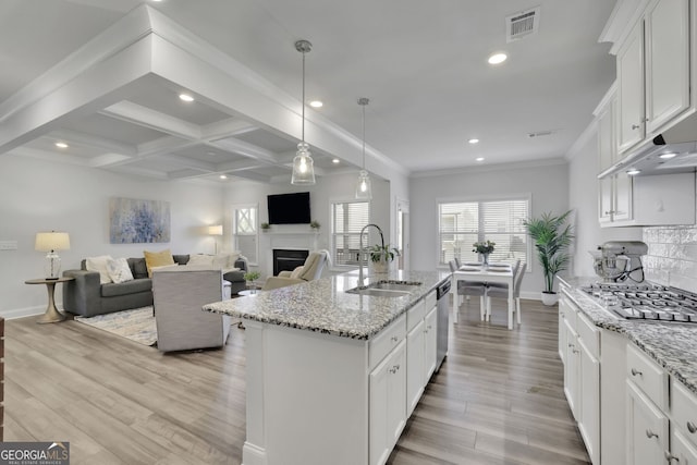 7108 Birch View Ct, Flowery Branch, GA 30542 - kitchen with stainless steel appliances, recessed lighting, light wood finished floors, white cabinets, and beamed ceiling