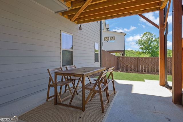 7108 Birch View Ct, Flowery Branch, GA 30542 - fenced backyard featuring a patio area and outdoor dining area