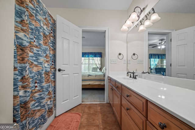 ensuite bathroom with tile patterned floors, ensuite bathroom, vanity, and ceiling fan