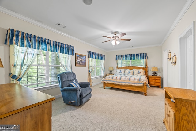 bedroom with a ceiling fan, crown molding, carpet floors, baseboards, and visible vents