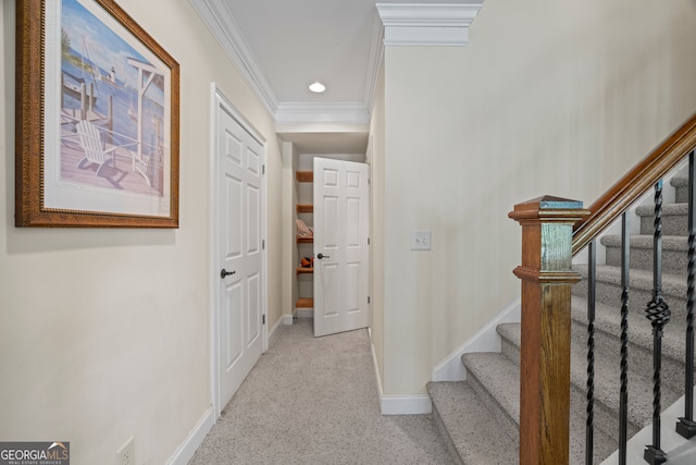 interior space with stairs, light carpet, baseboards, and ornamental molding