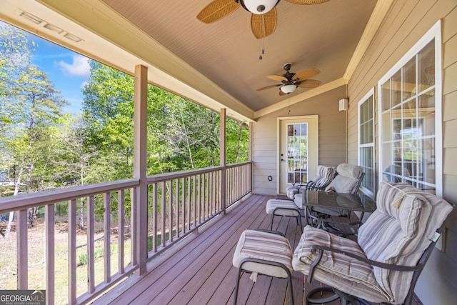 wooden deck with ceiling fan