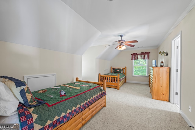 carpeted bedroom with a ceiling fan, baseboards, and crown molding