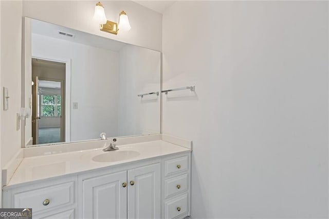 bathroom featuring visible vents and vanity