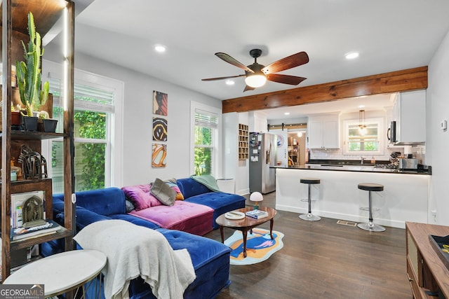 living room with recessed lighting, dark wood-style flooring, and ceiling fan