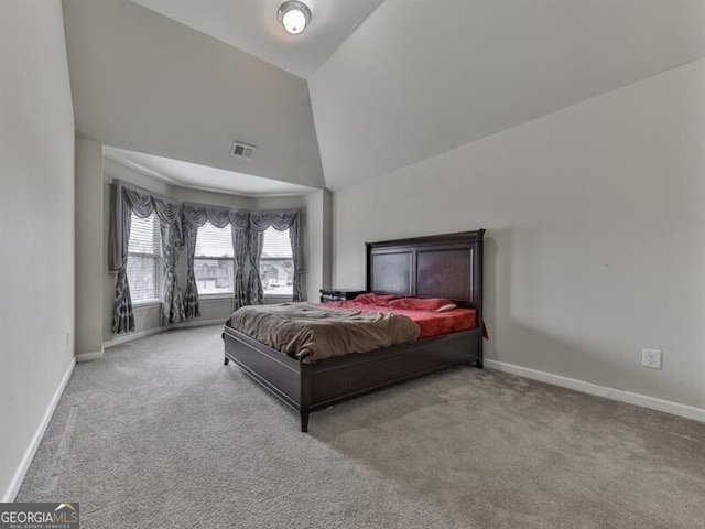 bedroom featuring lofted ceiling, visible vents, carpet flooring, and baseboards