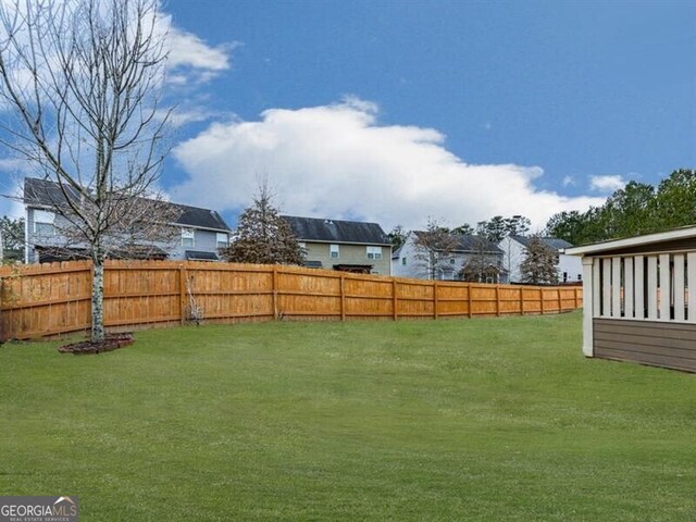 view of yard with a fenced backyard
