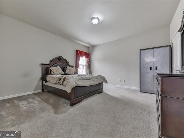 carpeted bedroom with baseboards