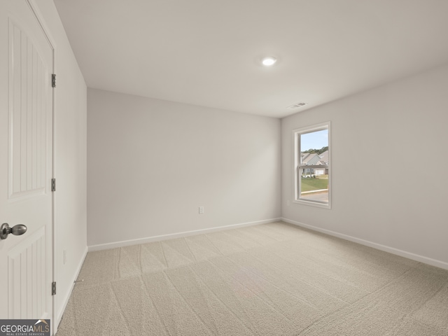 7162 Linden Dr, South Fulton, GA 30349 - unfurnished bedroom featuring baseboards and light carpet