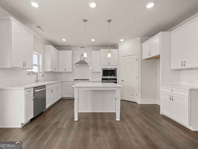 7162 Linden Dr, South Fulton, GA 30349 - kitchen with stainless steel appliances, dark wood-style floors, white cabinetry, recessed lighting, and crown molding