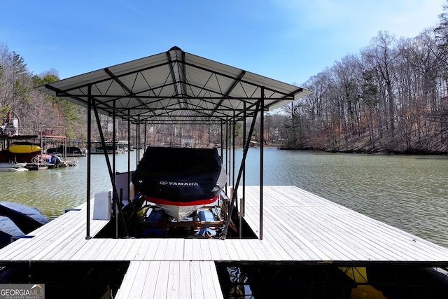 view of dock featuring boat lift and a water view