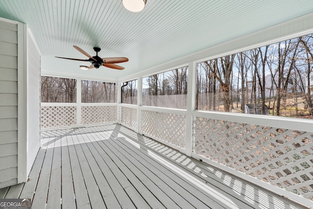wooden terrace featuring ceiling fan