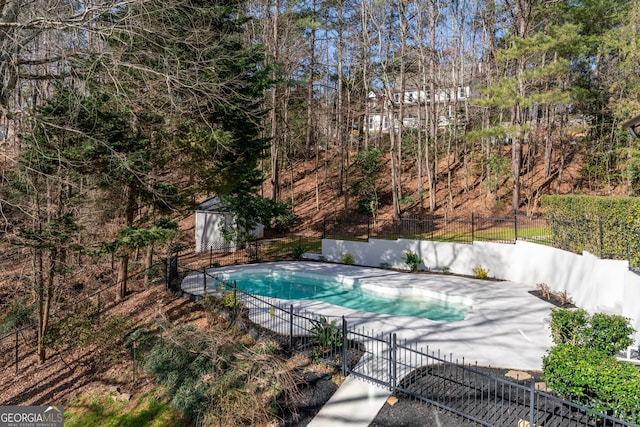 view of swimming pool with a fenced backyard, a fenced in pool, and a patio