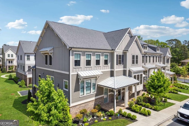 2004 Cortland Rd, Milton, GA 30009 - exterior space featuring a residential view, stone siding, a shingled roof, board and batten siding, and a front yard