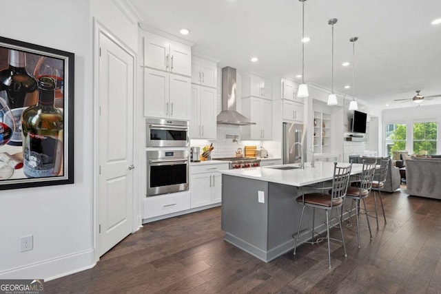 2004 Cortland Rd, Milton, GA 30009 - kitchen featuring wall chimney exhaust hood, appliances with stainless steel finishes, dark wood-style floors, and a sink