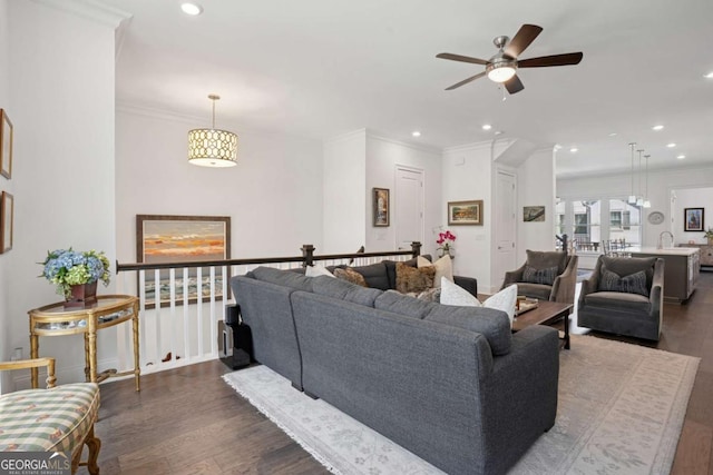 2004 Cortland Rd, Milton, GA 30009 - living area with wood finished floors, a ceiling fan, crown molding, a fireplace, and built in features