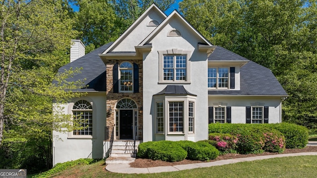 1820 Lyon Ave SW, Atlanta, GA 30331 - view of front of property featuring stucco siding, a chimney, stone siding, and roof with shingles
