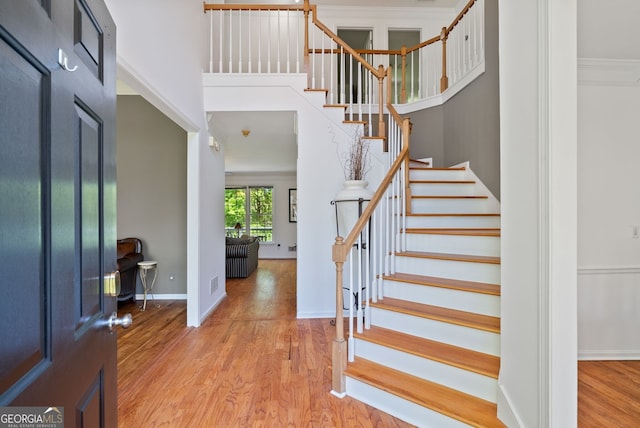 1820 Lyon Ave SW, Atlanta, GA 30331 - foyer featuring wood finished floors, stairs, a towering ceiling, and ornamental molding