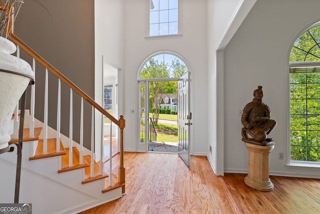 1820 Lyon Ave SW, Atlanta, GA 30331 - entryway with wood finished floors, plenty of natural light, a towering ceiling, and stairway