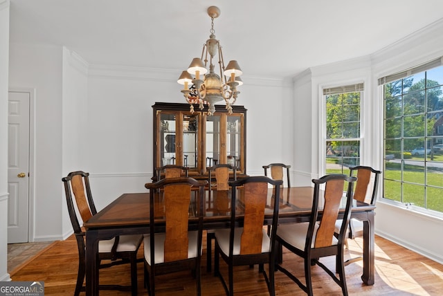 1820 Lyon Ave SW, Atlanta, GA 30331 - dining space with a chandelier, crown molding, and light wood-style flooring
