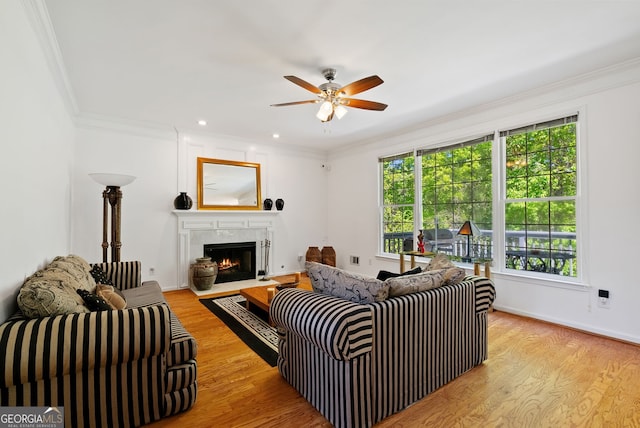 1820 Lyon Ave SW, Atlanta, GA 30331 - living room with ceiling fan, a fireplace with flush hearth, light wood-type flooring, crown molding, and recessed lighting