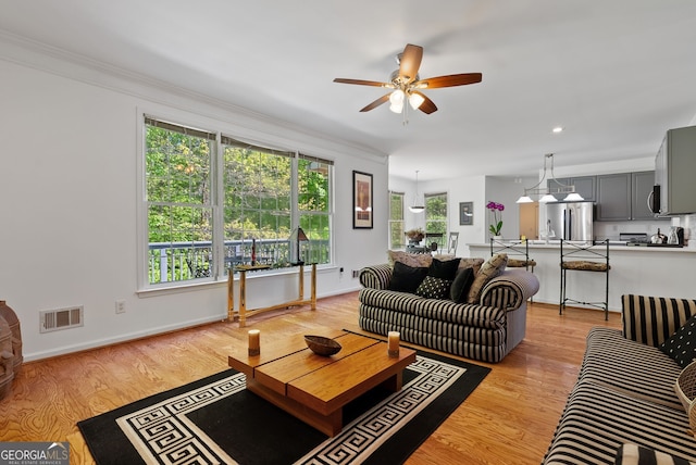 1820 Lyon Ave SW, Atlanta, GA 30331 - living room with a ceiling fan, ornamental molding, and light wood-style floors