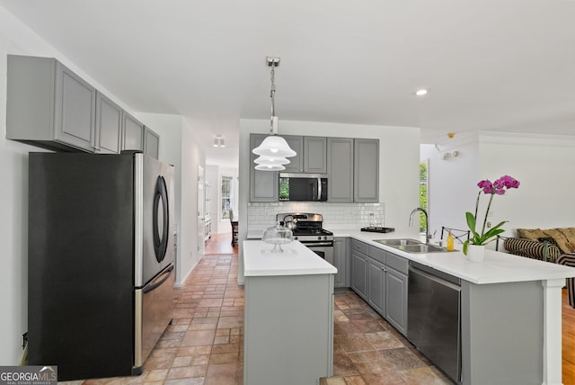 1820 Lyon Ave SW, Atlanta, GA 30331 - kitchen with stainless steel appliances, gray cabinets, a kitchen island, a peninsula, and decorative backsplash