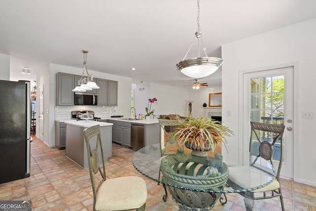 1820 Lyon Ave SW, Atlanta, GA 30331 - kitchen featuring gray cabinets, stainless steel appliances, light countertops, ceiling fan, and tasteful backsplash