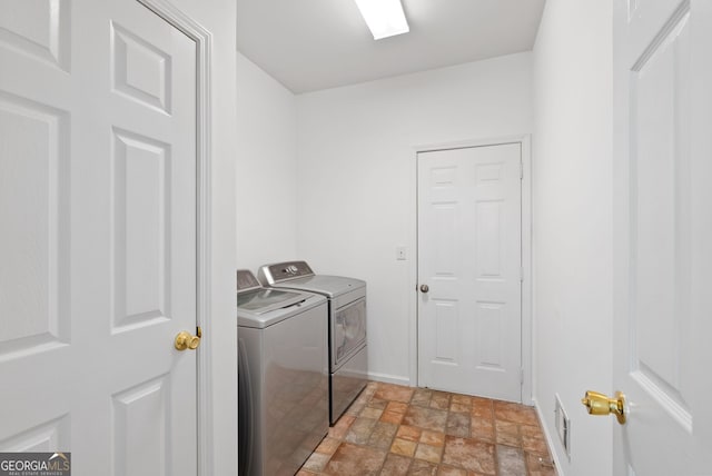 1820 Lyon Ave SW, Atlanta, GA 30331 - laundry area with washing machine and dryer and stone finish floors