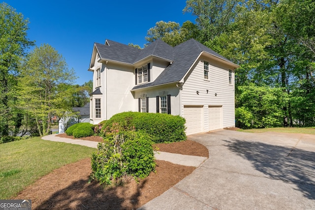 1820 Lyon Ave SW, Atlanta, GA 30331 - view of side of home featuring asphalt driveway, an attached garage, stucco siding, a lawn, and a shingled roof