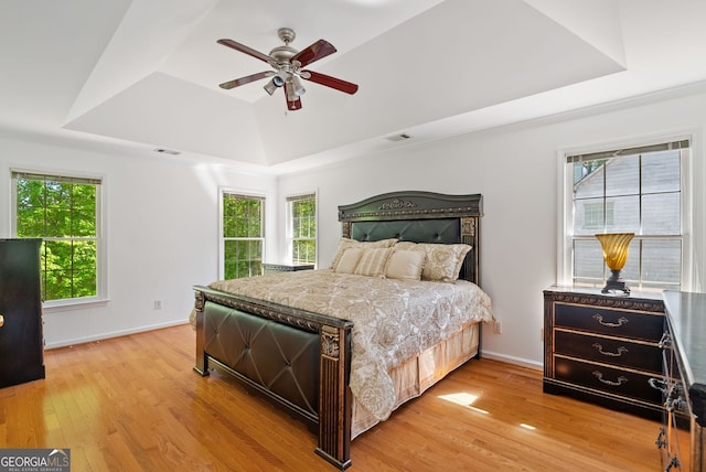 1820 Lyon Ave SW, Atlanta, GA 30331 - bedroom featuring a tray ceiling, light wood-style flooring, and ceiling fan