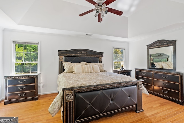 1820 Lyon Ave SW, Atlanta, GA 30331 - bedroom with light wood-style flooring, a raised ceiling, and ceiling fan