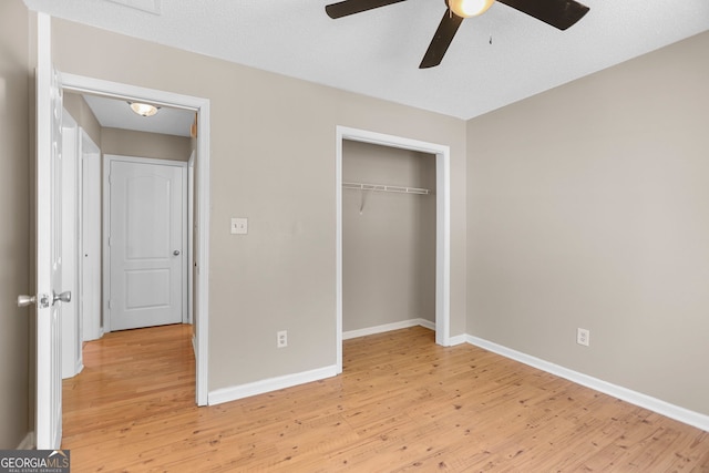 120 Hidden Brook Trl, Newnan, GA 30265 - unfurnished bedroom featuring light wood finished floors, a closet, and a ceiling fan