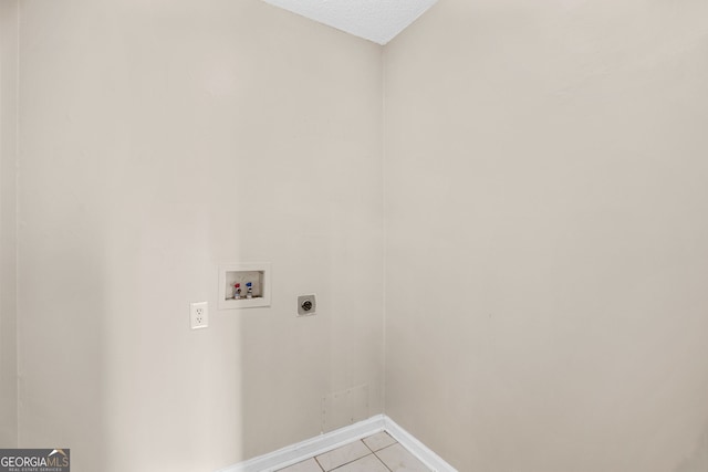 120 Hidden Brook Trl, Newnan, GA 30265 - laundry area with hookup for an electric dryer, hookup for a washing machine, and light tile patterned floors
