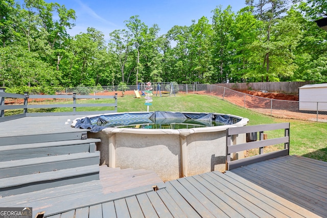 120 Hidden Brook Trl, Newnan, GA 30265 - wooden terrace featuring a fenced backyard and a playground