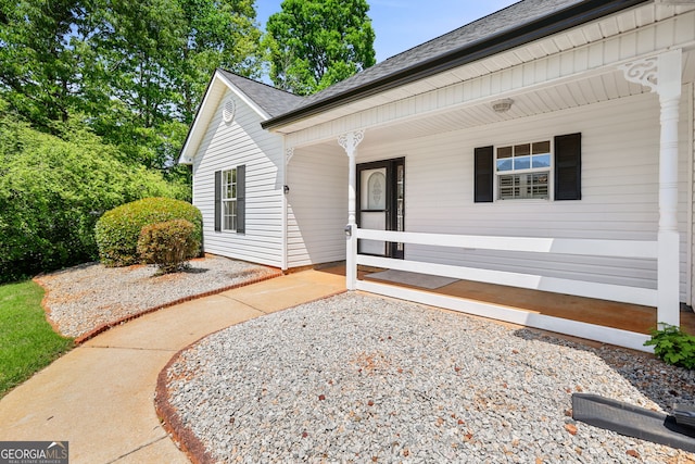 120 Hidden Brook Trl, Newnan, GA 30265 - view of exterior entry with a porch and roof with shingles