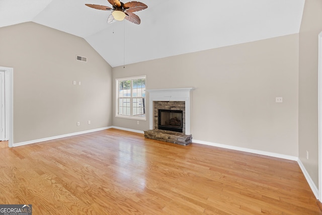 120 Hidden Brook Trl, Newnan, GA 30265 - unfurnished living room featuring ceiling fan, light wood-type flooring, a fireplace, and high vaulted ceiling