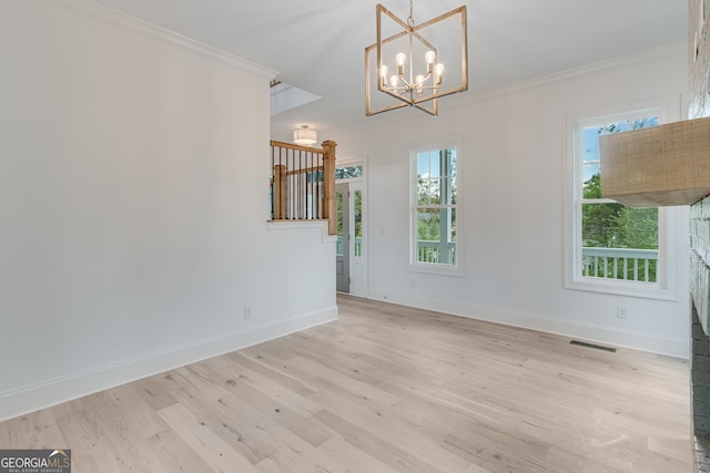 unfurnished dining area with light wood-type flooring, baseboards, visible vents, and crown molding