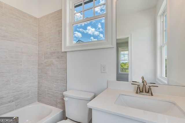 full bath featuring a wealth of natural light, toilet, vanity, and  shower combination