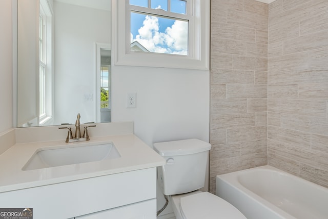 bathroom with toilet, vanity, and shower / bathing tub combination