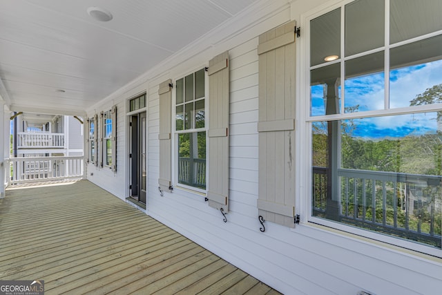 wooden terrace with a porch