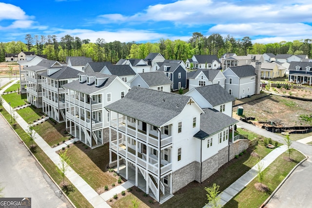 birds eye view of property with a residential view
