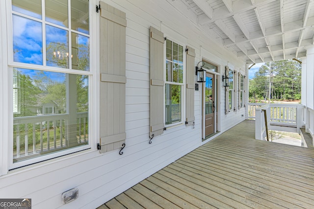 wooden terrace with a porch