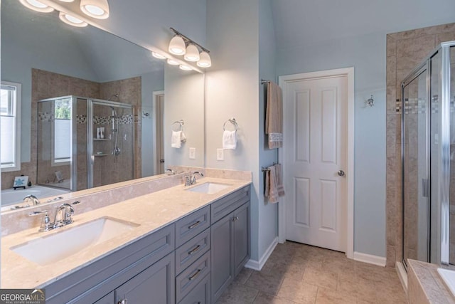 4236 Tacoma Trce, Suwanee, GA 30024 - full bathroom with a shower stall, double vanity, vaulted ceiling, a garden tub, and baseboards
