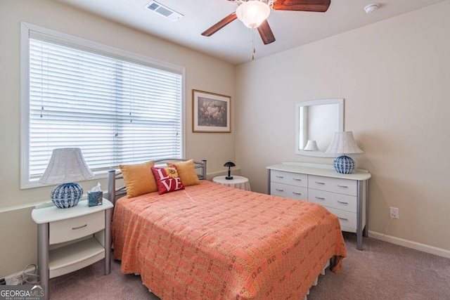 bedroom with light carpet, ceiling fan, and baseboards