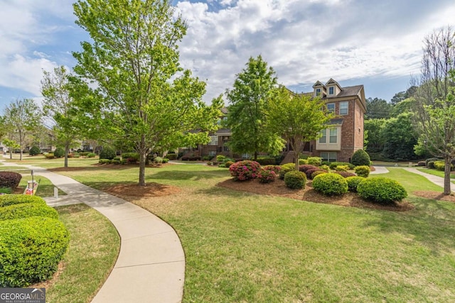 surrounding community with a lawn