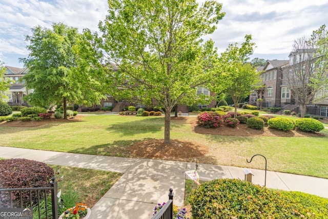 view of community featuring a lawn