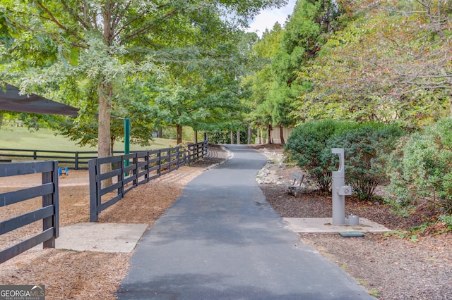 view of community featuring fence