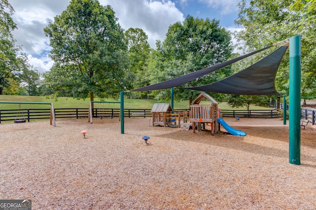 communal playground featuring fence