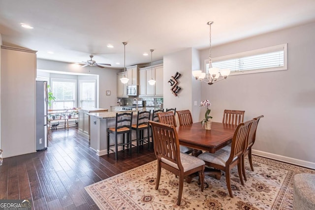 4236 Tacoma Trce, Suwanee, GA 30024 - dining area with dark wood-style flooring, a chandelier, baseboards, a ceiling fan, and recessed lighting